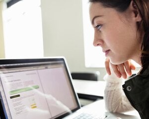woman looking at laptop screen