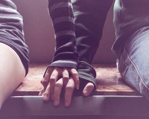 hand holding on top another