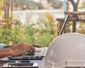 Construction worker on laptop