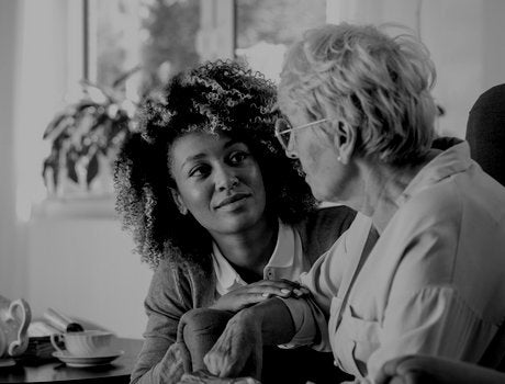 Female patient advocate with elderly woman