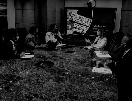 Doctor meeting on infection control in a board room