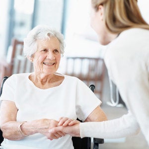 elderly woman in wheel chair with patient advocate