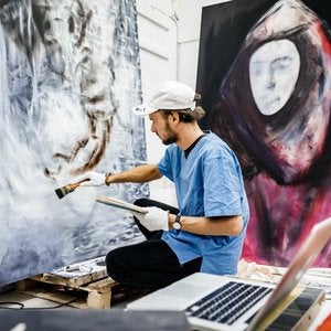 Man painting in his studio