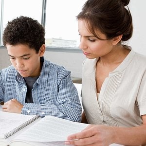 Female teacher with young boy