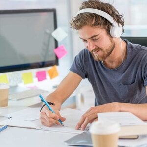 man sitting in front of computer