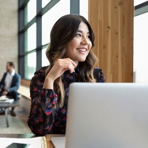 brunette woman with laptop