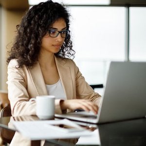 young woman using her laptop