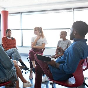 woman sharing with counseling group