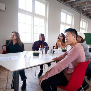 writers gathered around a table