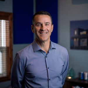 Man standing with blue shirt