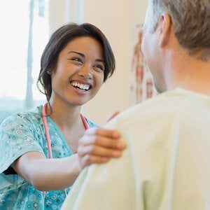 female medical assistant smiling at patient