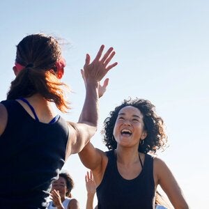 two women giving each other a high five