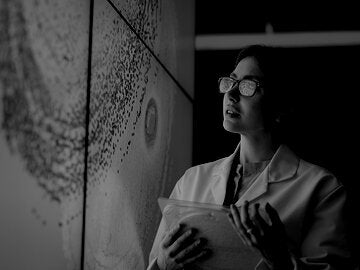 female analyst observing map