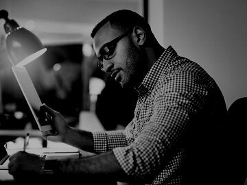 professional sitting at a computer