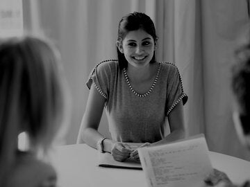 business woman meeting with client couple