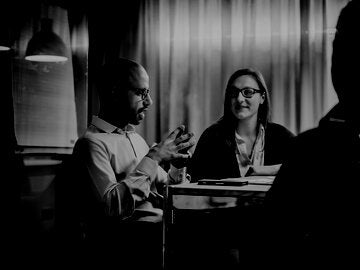 business people sitting around a table for a discussion