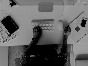 overhead view of someone on an apple computer