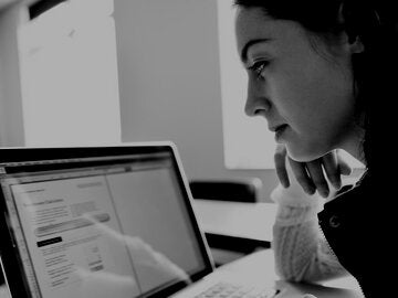 woman looking at laptop screen