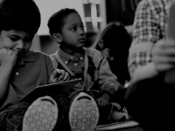children using tablets in elementary school