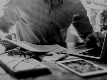 Man working on financials in office