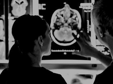 Radiologists looking at brain scans