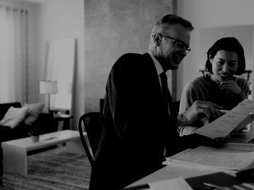 Woman planning investments with financial officer