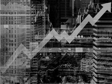 graphs and diagrams layered over highrise buildings