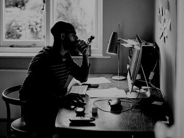 Man working at home on computer