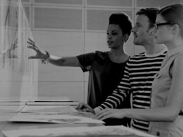 Designers reviewing portfolio pieces