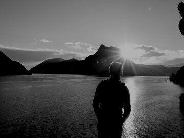man standing at the lake's edge