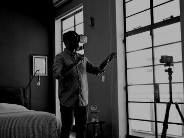 Man using a virtual reality headset in his apartment
