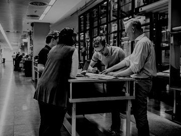 Staff meeting close to a production line