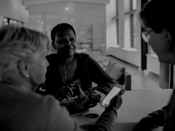 financial planner in discussion with clients