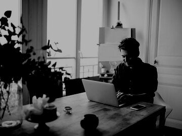 writer working at his kitchen table