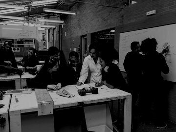 Group of students working with teachers at a workshop