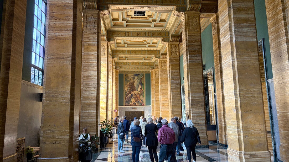 People walking through ArtDeco hall