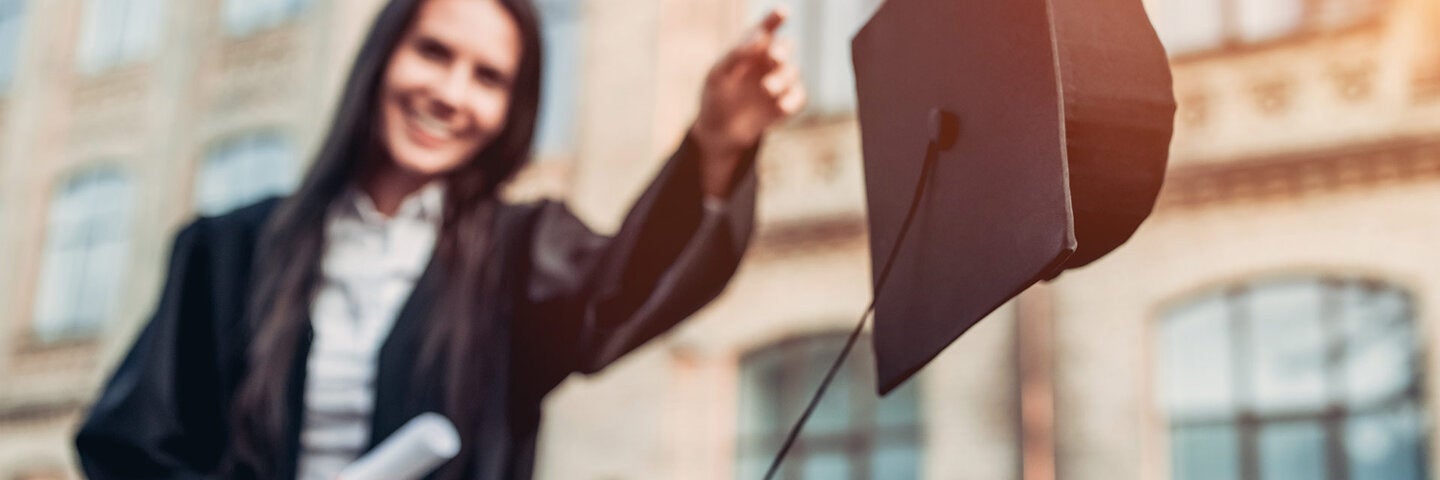 Graduate throwing her cap