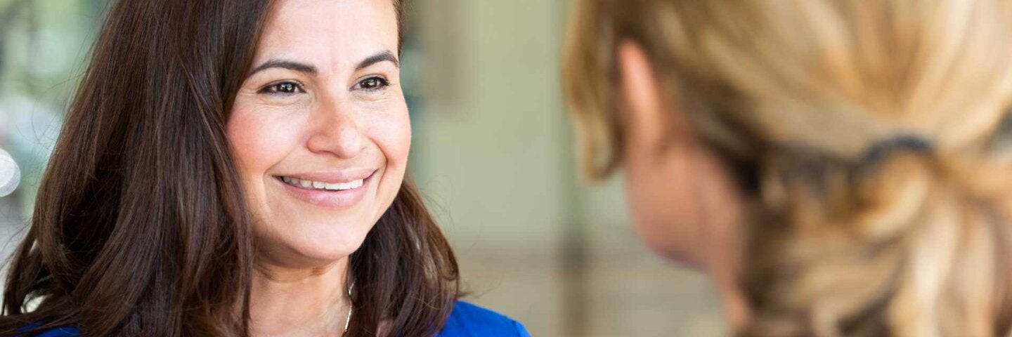 Mature women talking and laughing