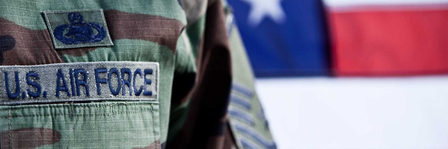 Close up for Air Force patch on officer's uniform.