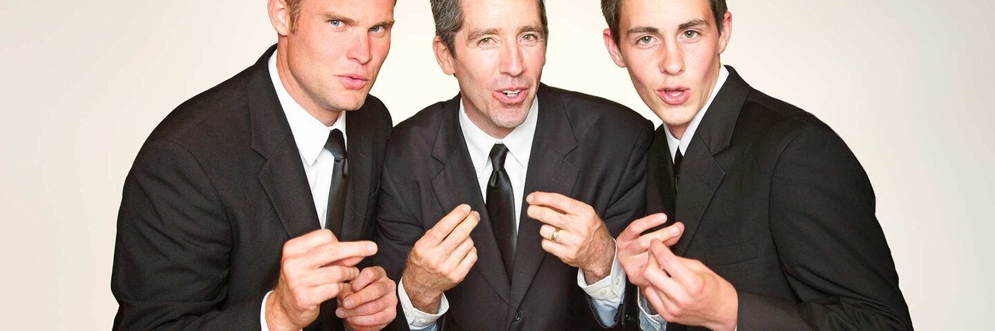 Male a capella trio in suits singing and snapping