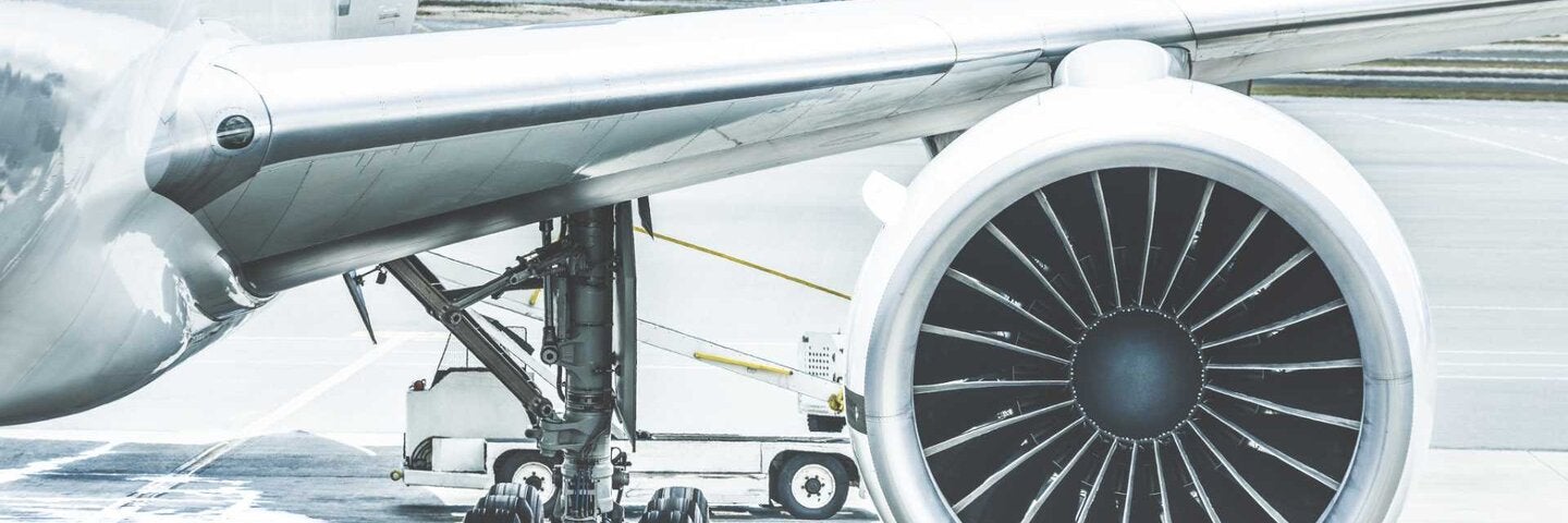 close up view of wing, engine and landing gear of an airplane
