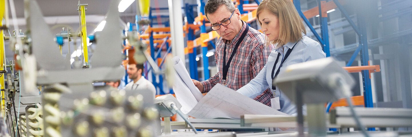 engineers checking manufacturing process