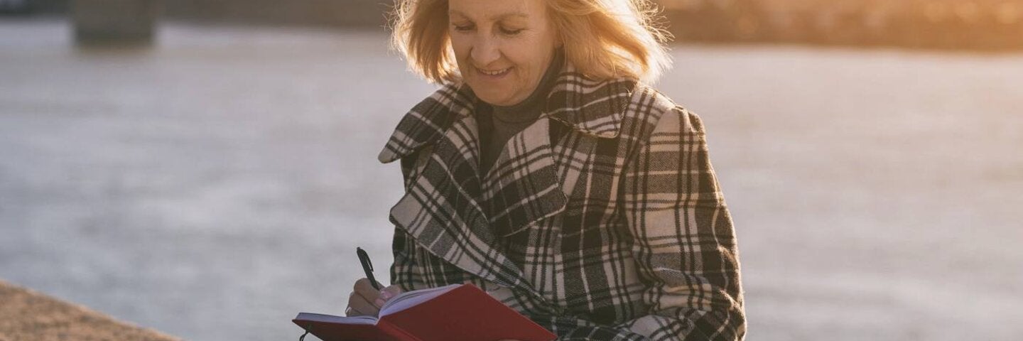 Senior woman writing