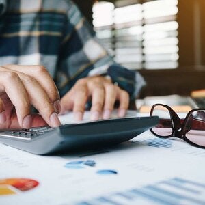 hands on a calculator