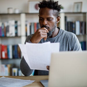 man editing his writing