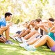 fitness instructor with group of people exercising